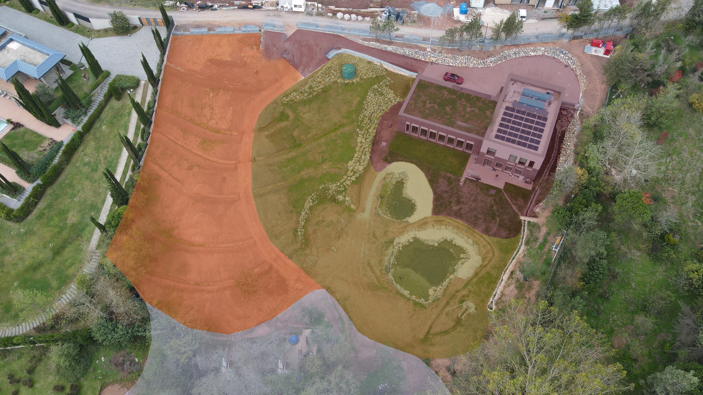 Aerial plan view of the site with coloured zones marked M0 to M3 radiating out from the building.